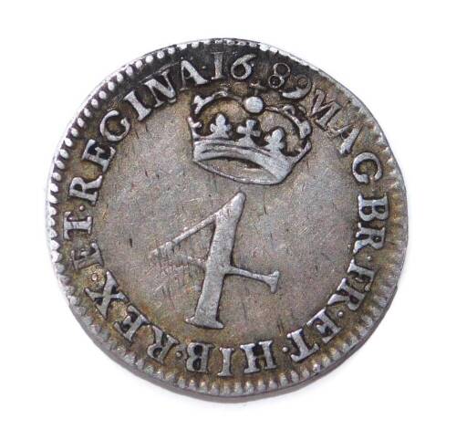 A William & Mary silver four pence coin, first bust, 2cm W.