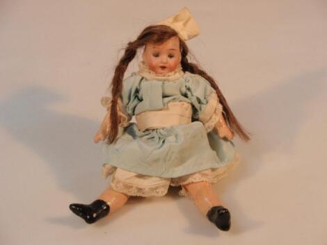 A small early 19th century German bisque leaded doll with sleep