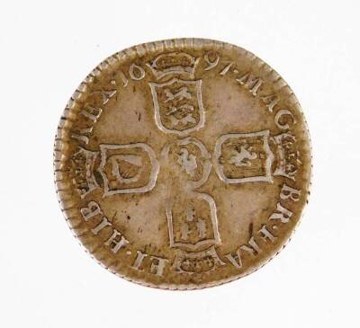 A William III silver sixpence, 1697, 2cm W.