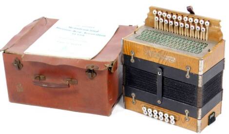 A early 20thC Viceroy accordion, in oak finished case with twelve top buttons and twenty one front keys, with a blind fret side, 27cm W. (in fitted case)