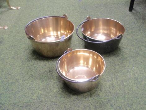 A graduated set of three Victorian brass preserve pans