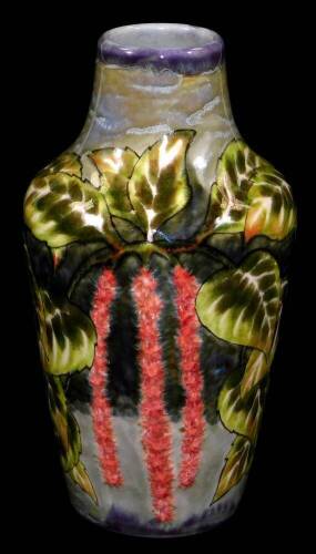 A Cobridge pottery vase by Philip Gibson, of shouldered form, decorated with trees and trailing branches, signed and impressed marks beneath, 18cm H. (boxed)