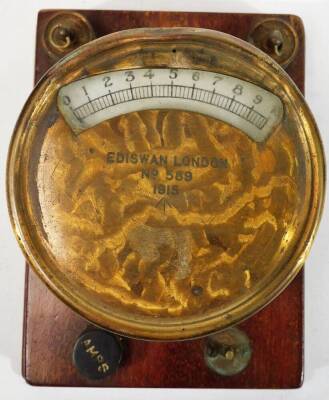 An Ediswan London 589 1915 volt meter gauge, numbered 1915 with crow's foot mark, on a wooden back in a leather case, 12cm H. - 2