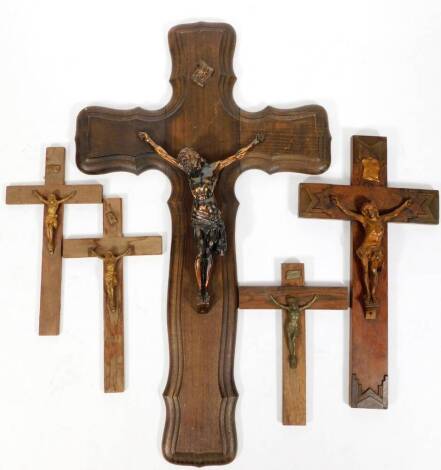 Various oak backed and metal crucifixes, to include several free standing examples, 60cm H, etc. (a quantity)