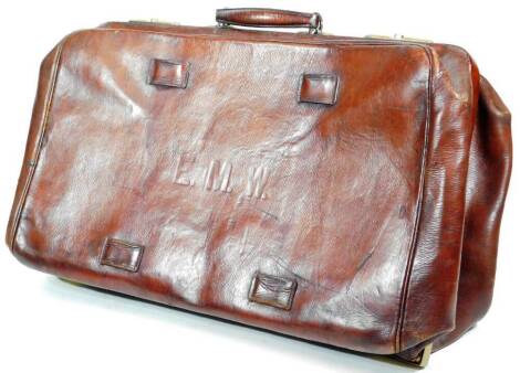 A large early 20thC brown leather Gladstone type bag, of rectangular form, with shaped handle initialled ENW, 69cm W.