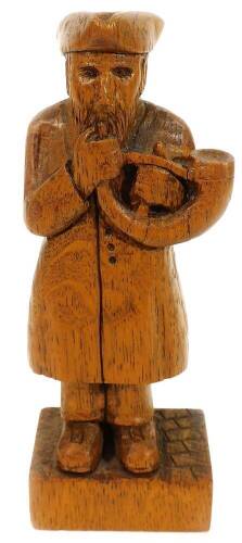 Bidwal (John). An English oak figure of the Ripon horn blower, 18cm H.