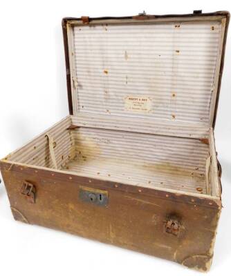 An early 20thC travel trunk, with Wagstaff & Sons, 23 Boscombe Arcade label, of rectangular form, initialled ESO with various part luggage labels, 66cm W, further cases, satchel, a vanity case and a pair of black leather hunting boots. (a quantity) - 5