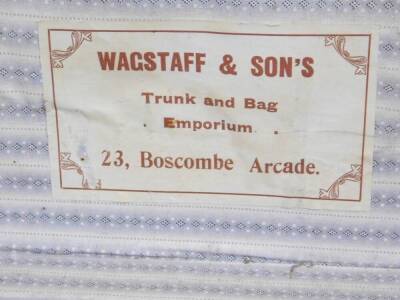 An early 20thC travel trunk, with Wagstaff & Sons, 23 Boscombe Arcade label, of rectangular form, initialled ESO with various part luggage labels, 66cm W, further cases, satchel, a vanity case and a pair of black leather hunting boots. (a quantity) - 6