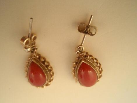 A pair of 9ct gold tear drop coral drop ear rings