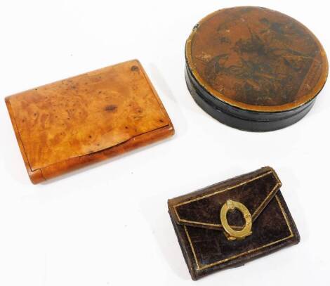 A Georgian papier mache patch box, of circular form, decorated with a scene to the lid, 9cm Dia. a burr wood snuff box with thumb mould handle and a miniature satchel type box. (a quantity)