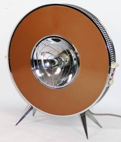 A vintage metal framed room heater, of circular form, with a pierced chrome mesh work border and a metal centre on tapering spoke legs, 69cm H, 65cm W, 22cm D.