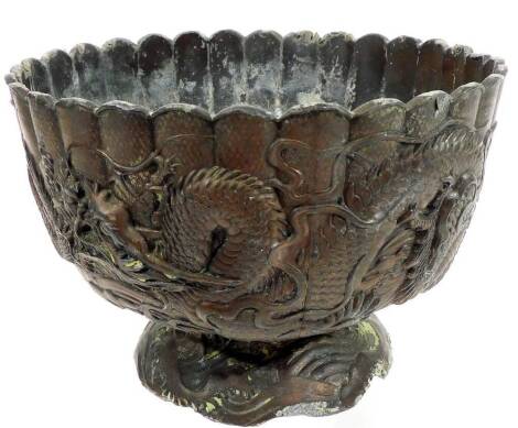 A Japanese cast metal jardiniere, of small proportion, the body raised with dragons on a floral foot, 11cm H.