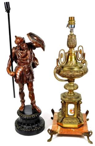 A late 20thC standing figure of a warrior, holding lamp head on an inverted acanthus leaf circular base, 65cm H and a Limoges type gilt metal lamp with urn top and a square marble finish base terminating in shaped feet. (2)