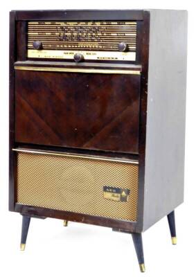 A mid 20thC ACE radiogram, in a rectangular cabinet, on turned legs with front tuning knops and grill speaker beneath, 82cm H, 49cm W, 33cm D.