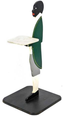 A 20thC figure card waiter, formed as a gentleman holding tray on rounded square base, 86cm H.