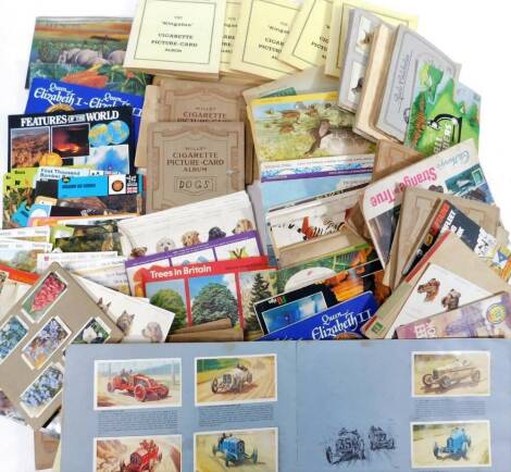 Various cigarette, trade and other cards mainly in albums, to include Wills Wild Flowers, Kingston Dogs, Wills and others Household Hints, various tea cards, Trees In Britain, etc. (a quantity)