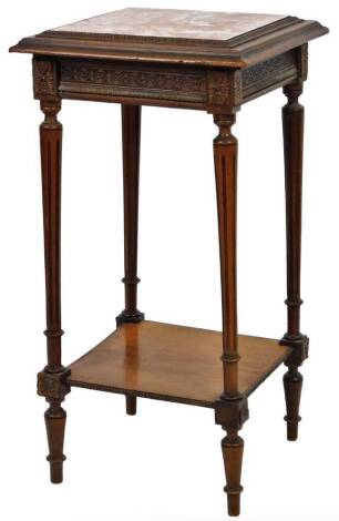 An early 20thC oak plant stand, of square form with a marble top, in textured colours in orange and cream, with acanthus leaf border, on turned tapering reeded legs joined by an undertier, 77cm H, 37cm W, 37cm D.