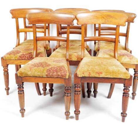 A set of six Victorian mahogany dining chairs, each with heavy comb top cresting rails and drop in seats in floral material, on turned front legs, 89cm H. (6)