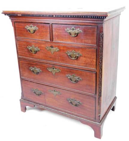 An late 18thC mahogany chest, of two short and three long cockbeaded drawers flanked by a blind fret on bracket feet, with plate back swan neck handles, 112cm H, 103cm W, 58cm D.