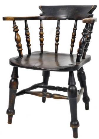 A late 19thC smoker's bow chair, with shaped cresting rail raised above turned spindles and shaped arms, on turned legs joined by a double stretcher, 82cm H.