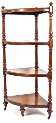 A Victorian mahogany corner whatnot, the shaped shelves broken by carved reeded columns, on turned feet terminating in castors, with a low gallery to the top, 126cm H, 63cm W, 46cm D.