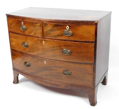 An early 19thC mahogany bow front chest, of two short and two long cockbeaded drawers, with plate back handles, with ivory escutcheons on splayed feet, 90cm H, 109cm W, 55cm D.