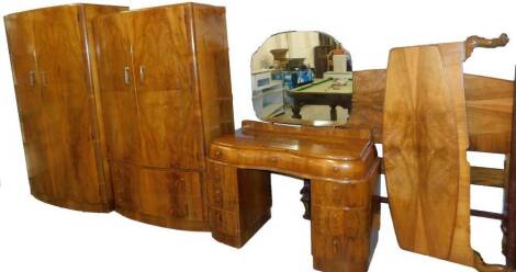 A mid 20thC Art Deco walnut bedroom suite, comprising double door wardrobe, compactum wardrobe, bed head, footboard and irons and mirror back dressing table of serpentine form, 152cm H, 117cm W, 53cm D.