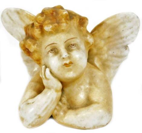 A Dresden porcelain cherub, in reflective mood, indistinctly marked beneath, 4cm H.