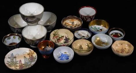 Various Japanese Satsuma and other pottery tea bowls and effects, a similar set of four biscuit porcelain tea bowls, decorated with figures in a naturalistic setting, 8cm Dia., a Satsuma bowl of circular form with gilt Japan mark beneath, various other te