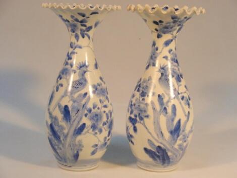 A pair of Chinese baluster vases with flared fluted rims painted in underglaze