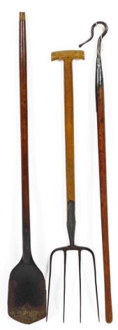 Bygone tools, wooden shovel, used for mudding out dyke bottoms, 126cm H, shepherd's crook and four pronged gripe.  (3)