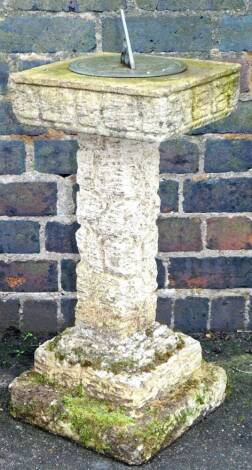 A modern concrete sundial, with square top, metal circular centre, square stem and stepped base, 78cm H.