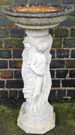 A white stone and concrete bird bath, with stem formed as The Three Graces, on octagonal base with plain circular top, 20cm H, 43cm Dia.