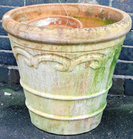 A terracotta garden planter, in classical form, of circular tapering form, 51cm H, 57cm Dia. and other planters. (a quantity)