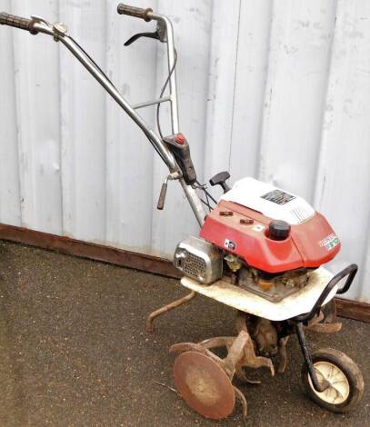 A Honda F210 hand push rotavator, 101cm H.