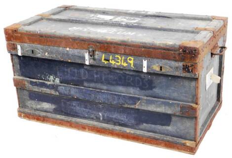 A late 19thC wooden trunk, of rectangular form, named Mccallum, with labels and side carrying handles, with metal mounts, 56cm H, 108cm W, 61cm D.