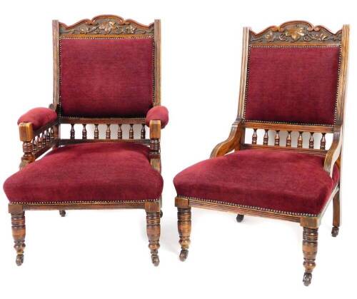 A pair of walnut occasional chairs, comprising of an armchair and open chair, each with heavily carved curved scroll topped cresting rails set with flowers, with overstuffed backs and seats, on turned front legs terminating in castors, 108cm H.