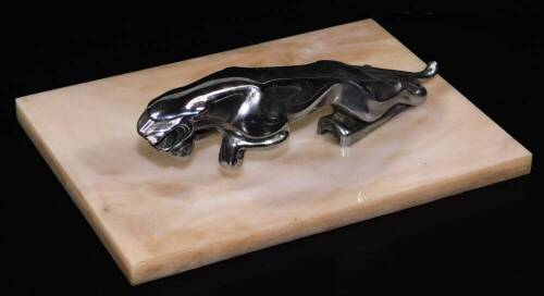 A chrome plated Jaguar mascot, 20cm L, on a marble finish base.