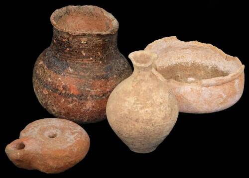 A hand thrown terracotta vessel, probably early terracotta, 11cm Dia., various other Roman bowls, a bulbous vase and a Roman style oil lamp. (4)