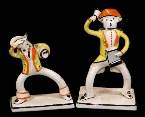 A pair of Surrealiststyle pottery figures, in the style of Bjorn Wiinblad the first as a town crier formed as a gentleman ringing bell in yellow jacket, with black and orange highlights, in the loose style of unmarked, 18cm H and another similar. (2)