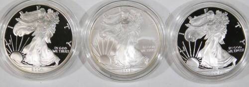 An American Eagle one ounce proof silver bullion coin sets, two include 2005, 2008, etc. each in outer box and packaging. (3)