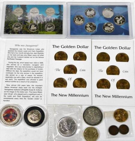 Various commemorative and other coins, Golden Dollar New Millennium Coin Saver card complete with five various coins, another, 2009 Columbia and US Territories quarters proof set, New York mint art decorated coin, Republic of Liberia dollar, Ronald Reagan