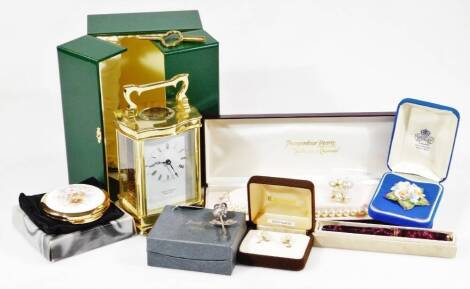 A quantity of modern costume jewellery and effects, a boxed David "Peterson carriage clock, gold and faux pearl earrings, brooch, compact, silver rose brooch, etc. (1 box)