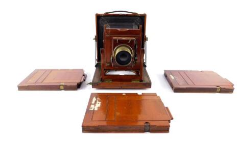 A late 19thC Thornton Pickard mahogany half plate bellows camera, with Retail stamp for Hora & Company, 'The Fairfield', Wandsworth, London., together with three mahogany plates.