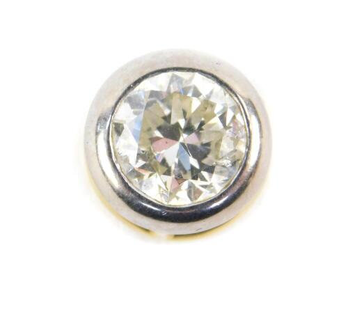 An 18ct gold and diamond pendant, in a circular two colour gold setting, approx 1.75ct, 3.2g.