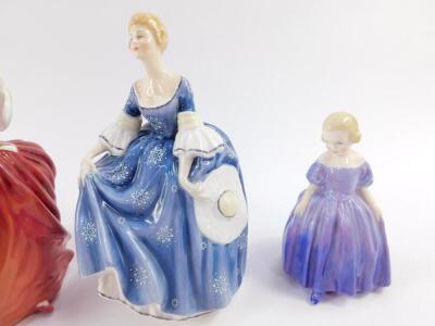 Four Royal Doulton figures, comprising The Last Waltz HN2315, Autumn Breezes HN1934, Hilary HN2335, and Marie HN1370. - 3