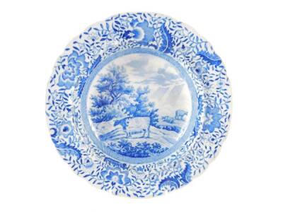 An early 19thC blue and white Durham Ox Series soup plate, printed with three cattle beside trees, within a floral border, 25cm Dia.