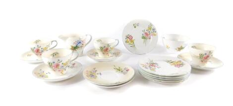 A Shelley porcelain part tea service decorated in the Wild Flowers pattern, comprising cream jug, sugar bowl, four cups, six saucers and tea plates.