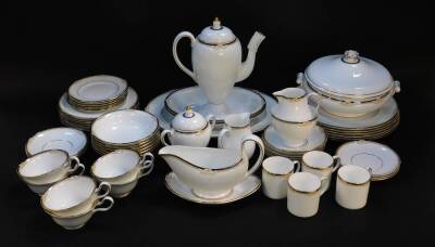 A Wedgwood porcelain part dinner tea and coffee service decorated in the Cavendish pattern, comprising oval meat platter, vegetable tureen and cover, sauce boat on stand, a pair of oval dishes, six dinner and dessert plates, six fruit bowls, coffee pot, s