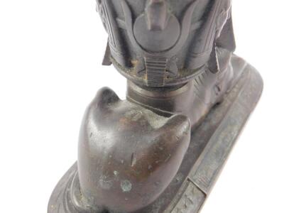 A Victorian bronze match striker and holder, modelled as a recumbent sphinx with a container on its back, cast with Pharaoh's masks, marked KR to base, 15.5cm W, together with a Victorian brass match casket, with striker, with engraved foliage decoration, - 2